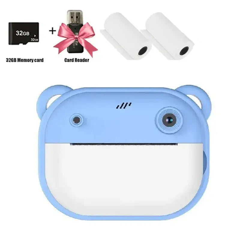 Blue children's digital camera with bear design, 32GB memory card, card reader, and printing paper rolls.