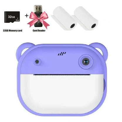 Children's digital camera in purple with 32GB memory card and printing rolls, designed for easy use by kids.