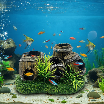 Decorative aquarium ornament with wooden barrels and grass
